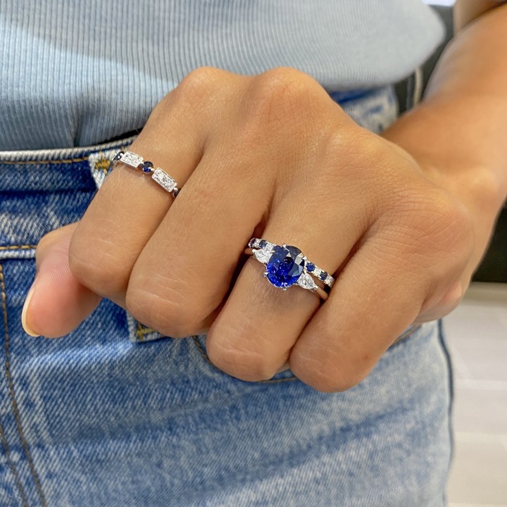 Blue Oval Sapphire and Diamond Three-Stone Ring flat