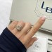 4.22 carat Emerald Cut Lab Diamond Signature Wrap Ring lifestyle box