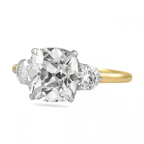 three stone moissanite ring with antique cushion cut center