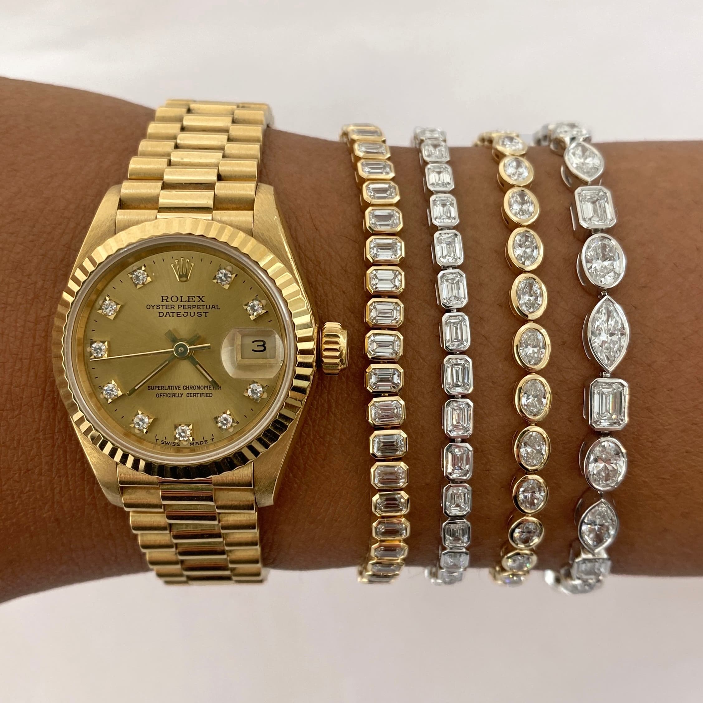 lady wrist neck wearing diamond tennis bracelets necklaces