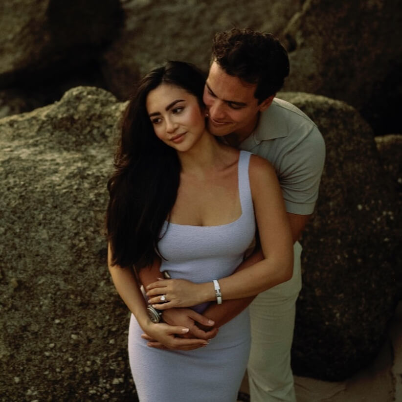 Engaged Couple Embracing Outdoors.