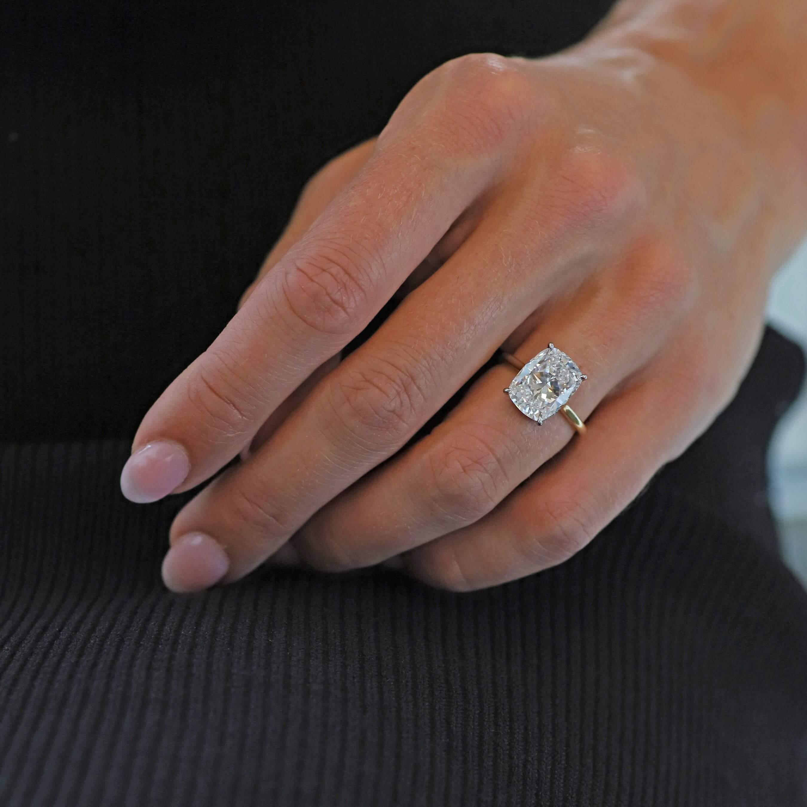 Diamond Engagement Ring on Woman's Finger.