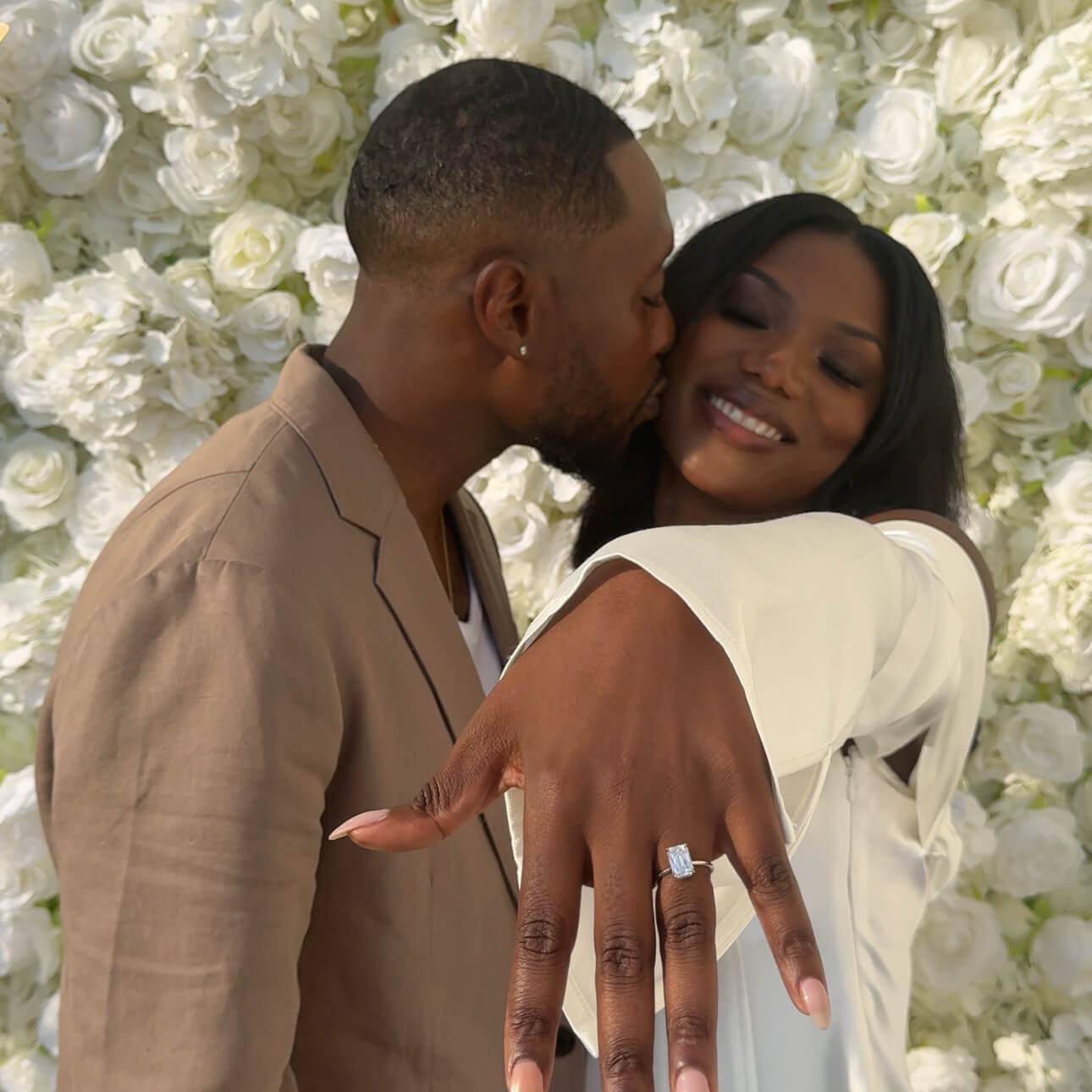 Engaged Couple Walking Down Staircase.